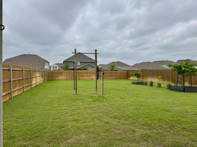 view of yard with a fenced backyard