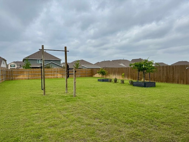 view of yard featuring a fenced backyard