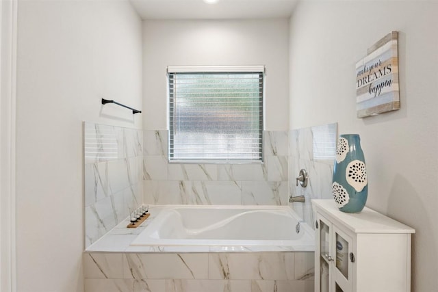bathroom featuring a washtub and a shower