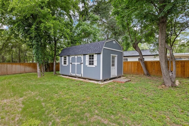 view of shed featuring a fenced backyard