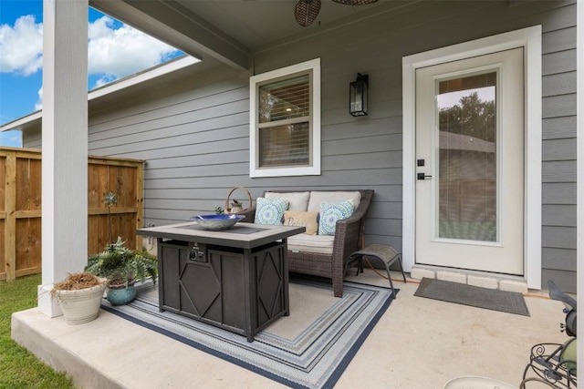 view of patio / terrace with an outdoor hangout area and fence