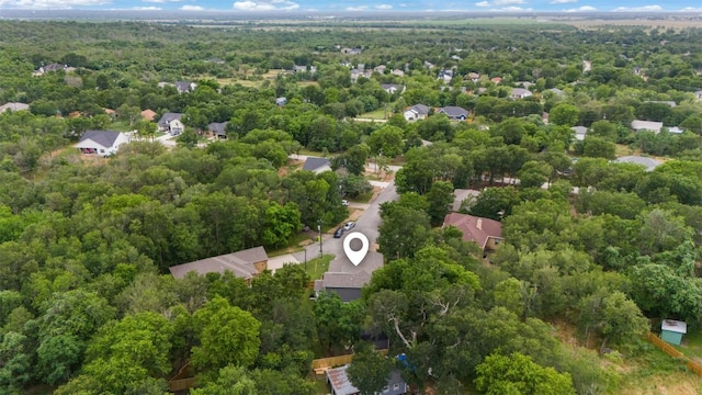 birds eye view of property with a wooded view