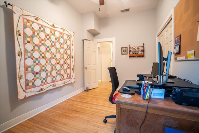 913 Fowzer St, Taylor, TX 76574 - office space featuring light wood-style floors, baseboards, ceiling fan, and visible vents
