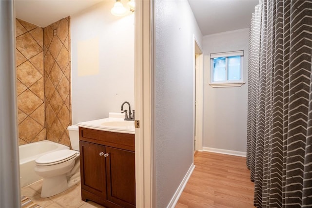 913 Fowzer St, Taylor, TX 76574 - bathroom featuring toilet, wood finished floors, and vanity