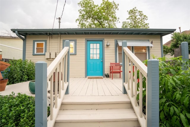 913 Fowzer St, Taylor, TX 76574 - property entrance featuring a wooden deck