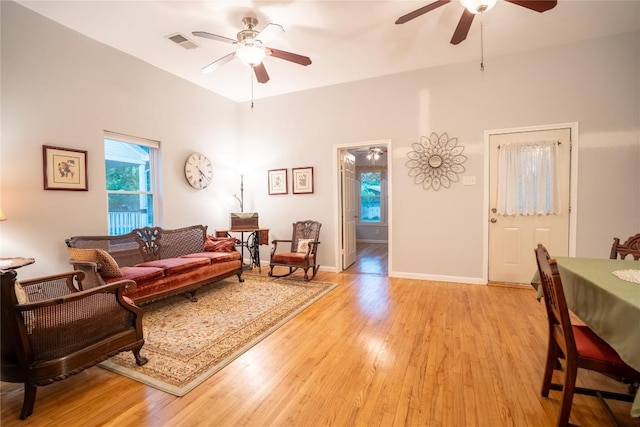 913 Fowzer St, Taylor, TX 76574 - living area with ceiling fan, visible vents, baseboards, and light wood-style floors