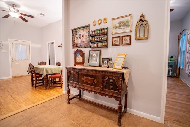 913 Fowzer St, Taylor, TX 76574 - corridor featuring visible vents, baseboards, and wood finished floors