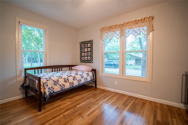 913 Fowzer St, Taylor, TX 76574 - bedroom with baseboards and light wood-type flooring