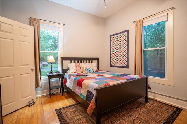 913 Fowzer St, Taylor, TX 76574 - bedroom featuring baseboards and hardwood / wood-style floors