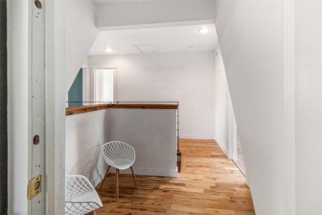 walk in closet with wood finished floors