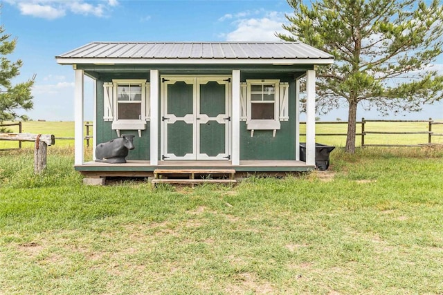 view of shed featuring fence
