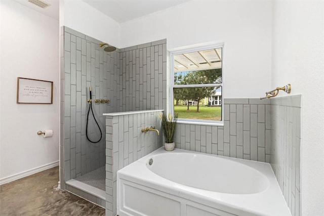 full bath with a walk in shower, concrete flooring, visible vents, and a garden tub