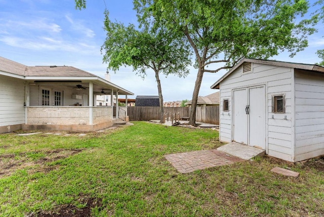1564 Lorson Loop, Round Rock, TX 78665 - fenced backyard featuring a ceiling fan and a storage shed