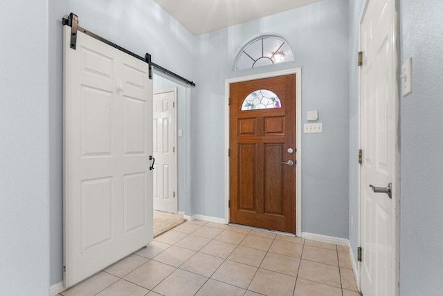 1564 Lorson Loop, Round Rock, TX 78665 - entryway featuring a barn door and light tile patterned floors