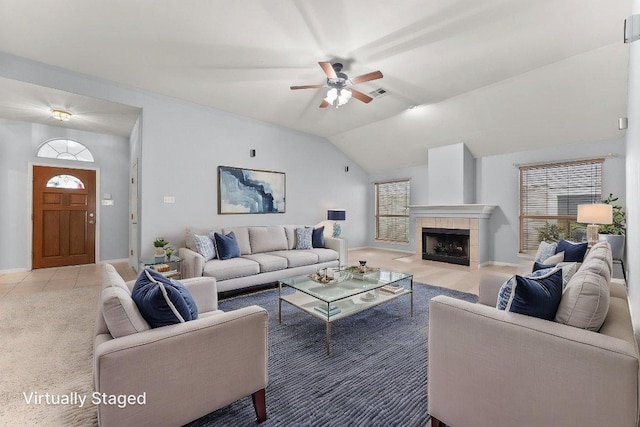 1564 Lorson Loop, Round Rock, TX 78665 - living area featuring a ceiling fan, vaulted ceiling, and a tiled fireplace