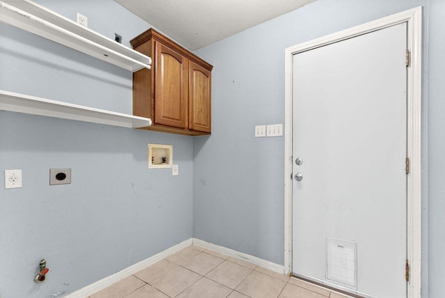 1564 Lorson Loop, Round Rock, TX 78665 - laundry room featuring washer hookup, electric dryer hookup, cabinet space, and light tile patterned floors