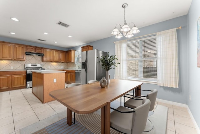 1564 Lorson Loop, Round Rock, TX 78665 - dining room with light tile patterned floors, a chandelier, and recessed lighting