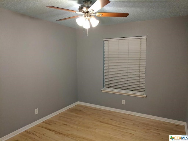 1502 Stratford Dr, Killeen, TX 76549 - unfurnished room featuring ceiling fan, wood finished floors, and a textured ceiling