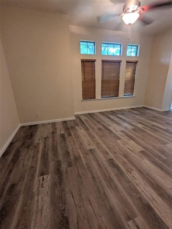1502 Stratford Dr, Killeen, TX 76549 - empty room with plenty of natural light, dark wood finished floors, and a ceiling fan