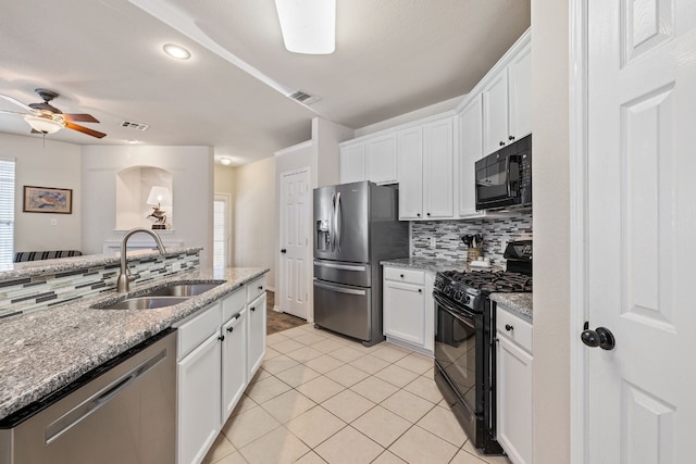 1900 Scofield Ridge Parkway Unit 1903, Austin, TX 78727 - kitchen featuring ceiling fan, white cabinetry, tasteful backsplash, a sink, and black appliances