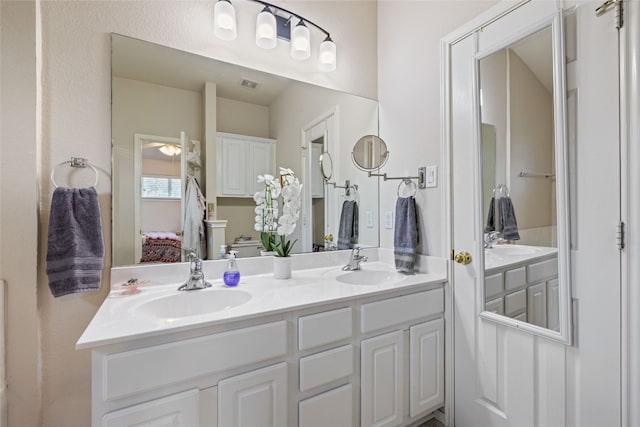 1900 Scofield Ridge Parkway Unit 1903, Austin, TX 78727 - bathroom with a sink, double vanity, and visible vents