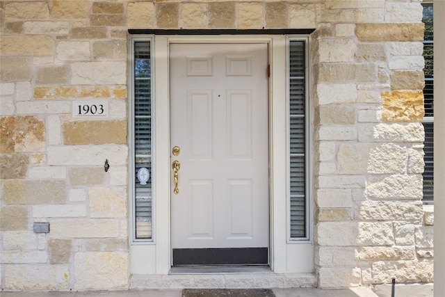 1900 Scofield Ridge Parkway Unit 1903, Austin, TX 78727 - doorway to property with stone siding
