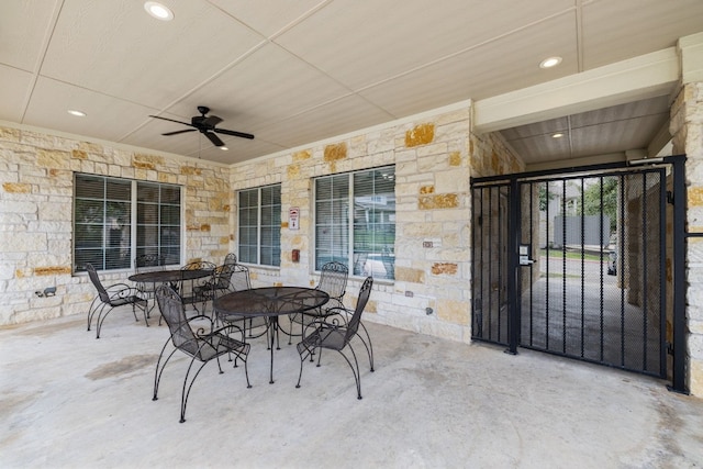 1900 Scofield Ridge Parkway Unit 1903, Austin, TX 78727 - view of patio / terrace with outdoor dining area, a ceiling fan, and a gate