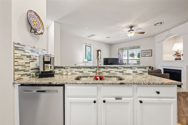 1900 Scofield Ridge Parkway Unit 1903, Austin, TX 78727 - kitchen with a sink, visible vents, stainless steel dishwasher, and open floor plan