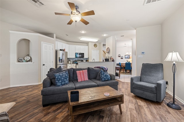 1900 Scofield Ridge Parkway Unit 1903, Austin, TX 78727 - living room with a ceiling fan, baseboards, visible vents, and dark wood-type flooring