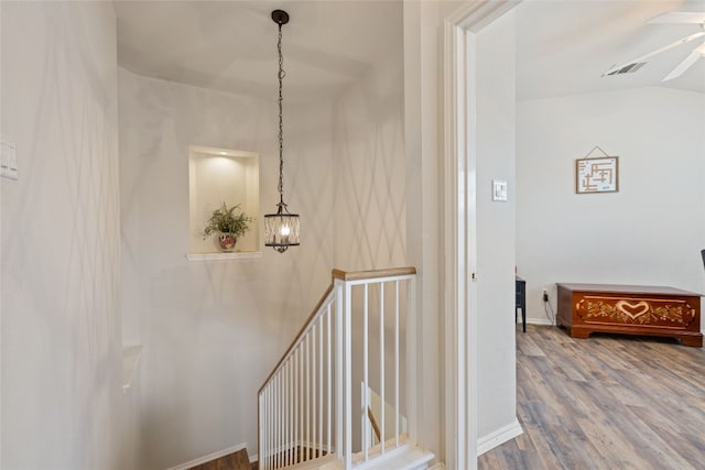 1900 Scofield Ridge Parkway Unit 1903, Austin, TX 78727 - hall with baseboards, visible vents, wood finished floors, and an upstairs landing