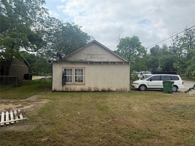 view of home's exterior with a lawn