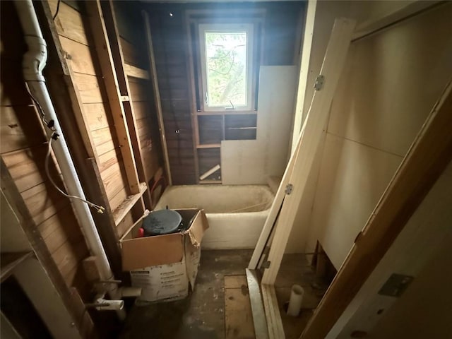 bathroom featuring a bath and a shower