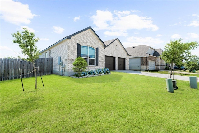 210 Maroon Ln, Kyle, TX 78640 - french country inspired facade with brick siding, driveway, and a garage
