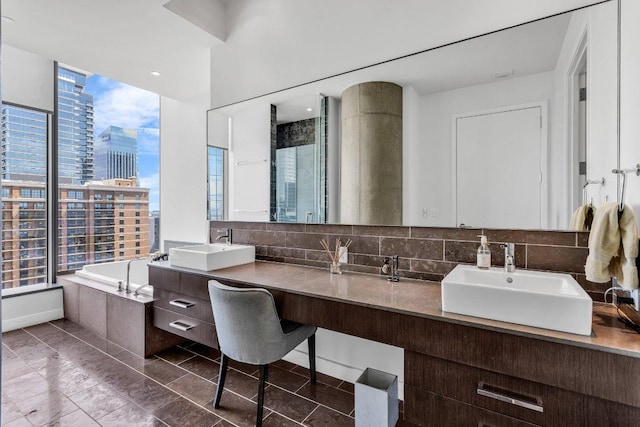210 Lavaca St Unit 2308, Austin, TX 78701 - full bathroom featuring a view of city, a garden tub, double vanity, and a sink