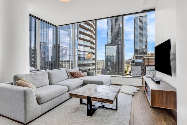 210 Lavaca St Unit 2308, Austin, TX 78701 - living room with baseboards, floor to ceiling windows, and hardwood / wood-style flooring