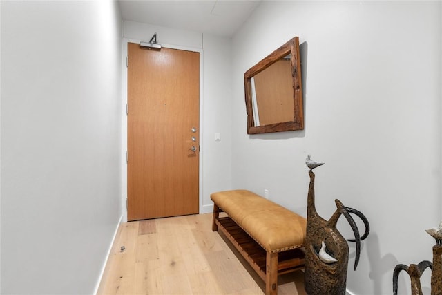 44 E Ave Unit 2907, Austin, TX 78701 - doorway featuring light wood-style flooring and baseboards
