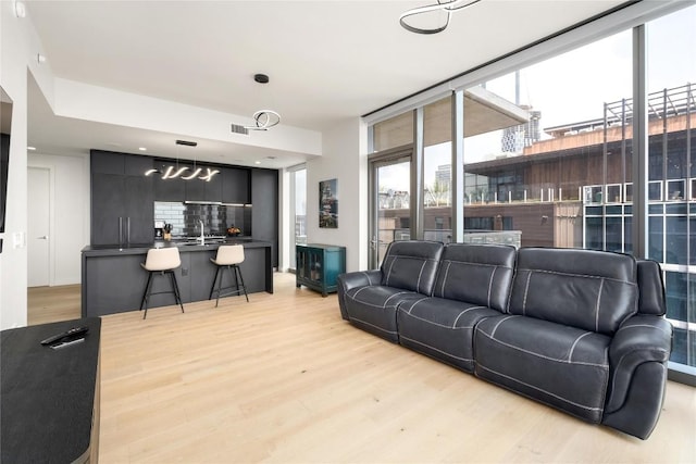44 E Ave Unit 2907, Austin, TX 78701 - living room featuring light wood-style floors and visible vents