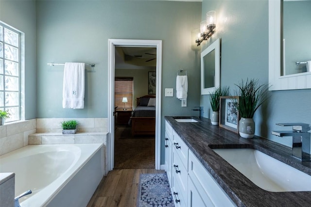 511 Shadywood Ln, Dripping Springs, TX 78620 - full bath with ensuite bath, double vanity, a bath, and plenty of natural light