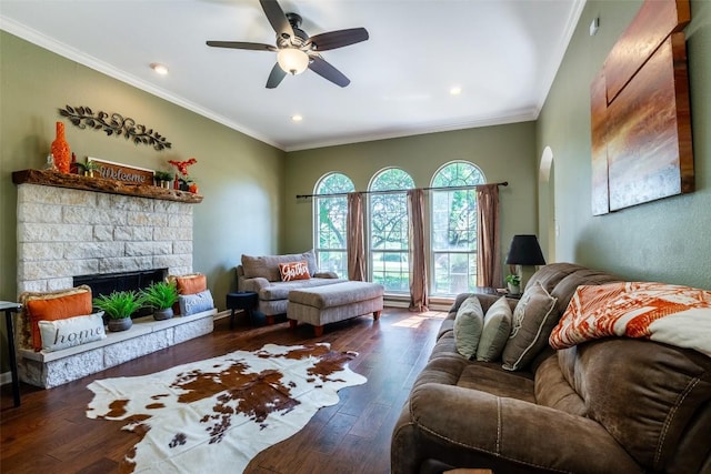 511 Shadywood Ln, Dripping Springs, TX 78620 - living area with wood finished floors, ceiling fan, a fireplace, recessed lighting, and ornamental molding