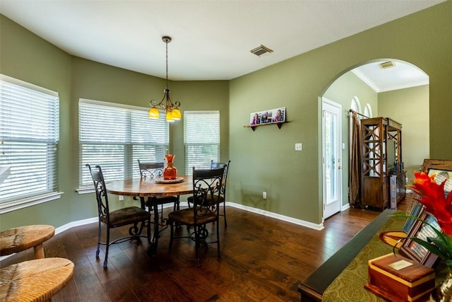 511 Shadywood Ln, Dripping Springs, TX 78620 - dining room with arched walkways, wood-type flooring, baseboards, and ornamental molding