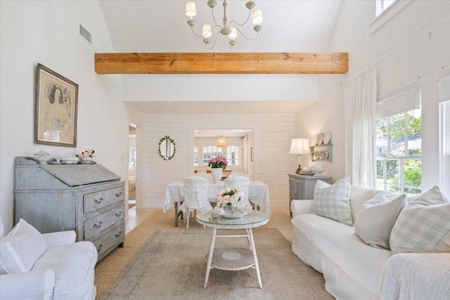 living room with a notable chandelier, high vaulted ceiling, visible vents, and beam ceiling