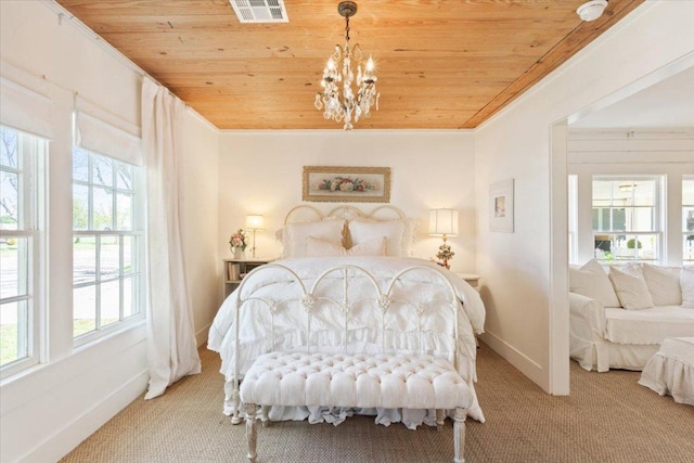 carpeted bedroom featuring multiple windows, wooden ceiling, visible vents, and baseboards