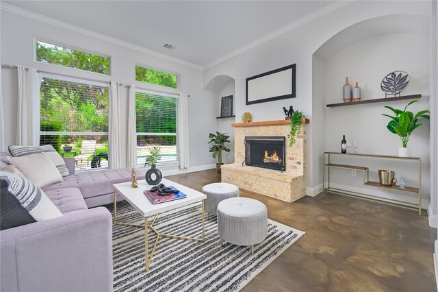 14912 Swallow Tailed Kite Dr, Austin, TX 78738 - living room with finished concrete floors, ornamental molding, baseboards, and a lit fireplace