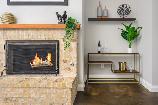 14912 Swallow Tailed Kite Dr, Austin, TX 78738 - detailed view of concrete floors, baseboards, and a fireplace