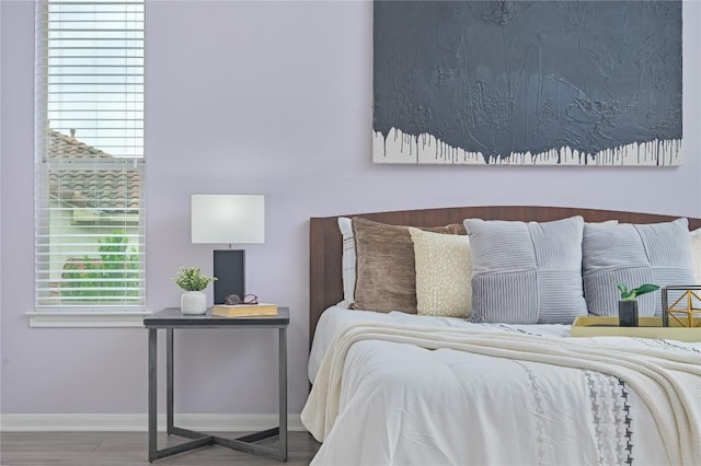 bedroom featuring baseboards