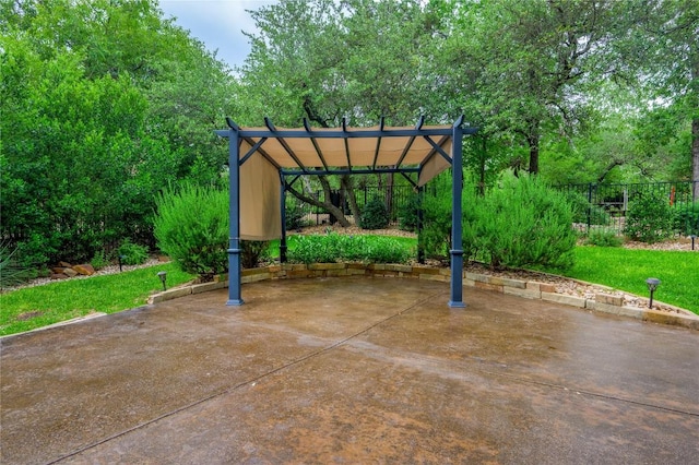 view of patio featuring fence