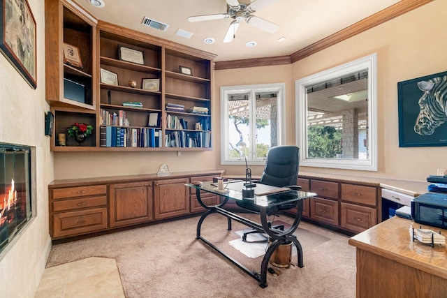 26302 Countryside Dr, Spicewood, TX 78669 - home office with light colored carpet, ceiling fan, and crown molding