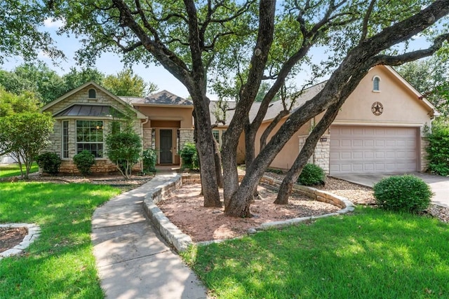 105 Saddle Trl, Georgetown, TX 78633 - view of front facade featuring driveway, a garage, stucco siding, stone siding, and a front lawn
