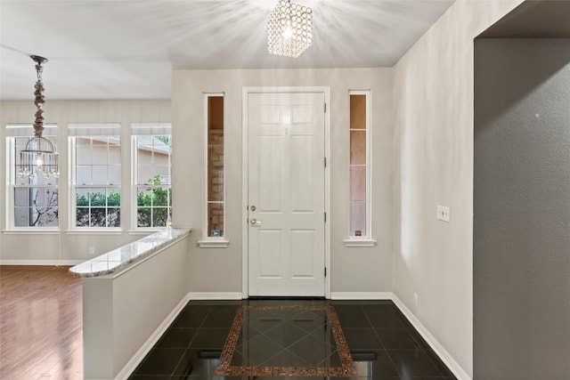 105 Saddle Trl, Georgetown, TX 78633 - entryway featuring baseboards and an inviting chandelier