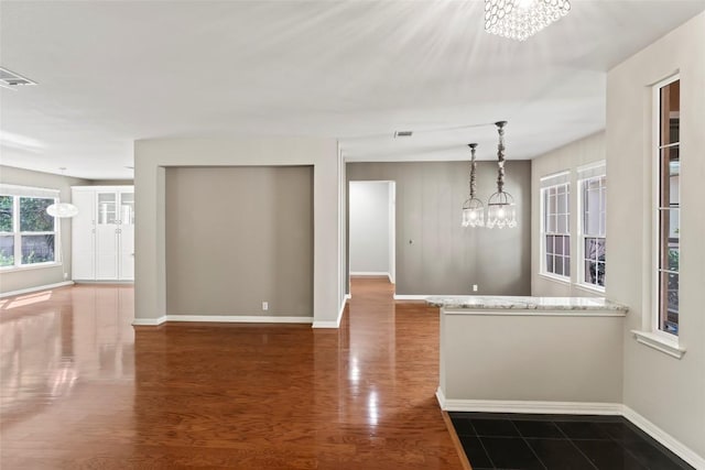 105 Saddle Trl, Georgetown, TX 78633 - interior space with a notable chandelier, dark wood-style floors, baseboards, and visible vents